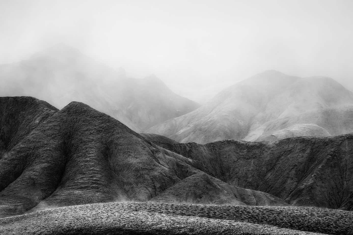 Layers of badlands are revealed as a thick storm clears (Death Valley National Park, California)